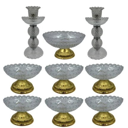 تصویر ست هفت‌سین باکارات که شامل شمع‌ها و کاسه‌های کریستال با کیفیت بالا و طراحی زیبا، مناسب برای جشن نوروز است.